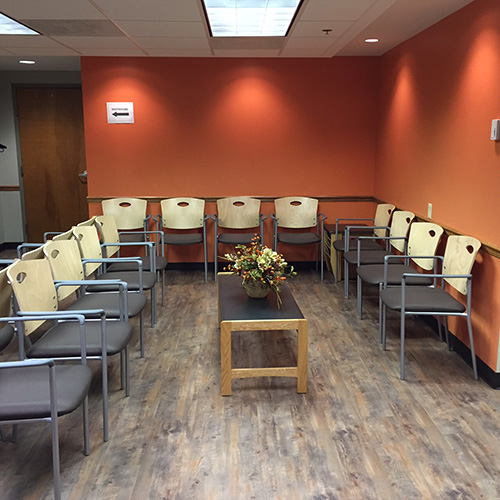 surgical eye center sitting room full of chairs.